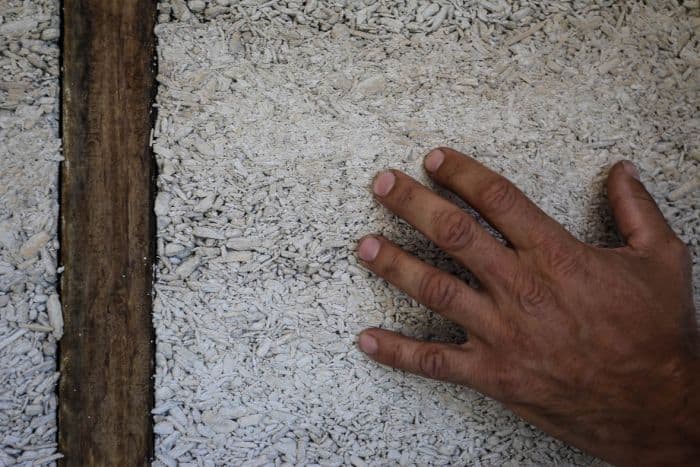 Hand against wall made from hemp